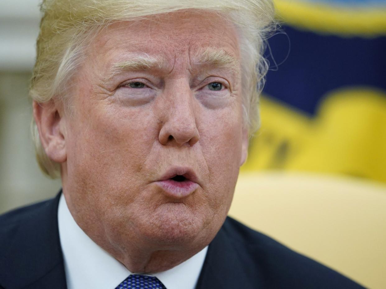 <p>Donald Trump speaks during a meeting with former US Secretary of State Henry Kissinger in the Oval Office of the White House in Washington, DC</p> (AFP via Getty Images)