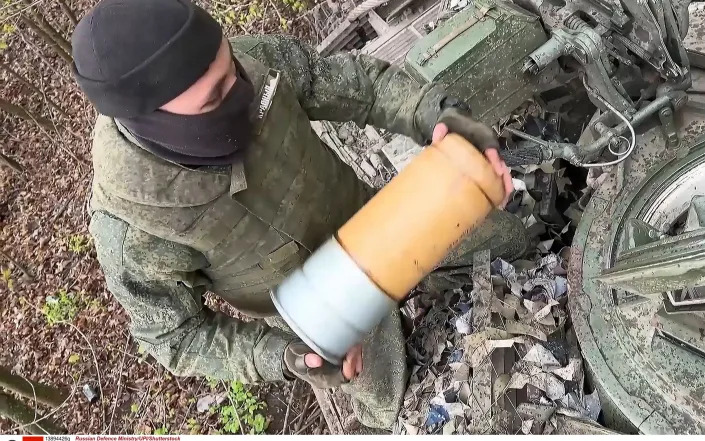 A Russian soldier from the Southern MD T-72B3 tank crews launching strikes on Ukrainian targets, from an unknown location on May 1, 2023 - Russian Defence Ministry/UPI/Shutterstock