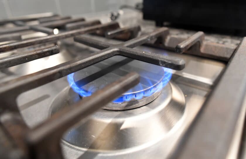 Mountain View, CA - DECEMBER 01, 2021 - A gas stove is seen lit as Stanford researchers monitor air pollution in the kitchen area of a monitoring station in a vacant apartment in Mountain View, California on December 01, 2021. (Josh Edelson/for the Times)