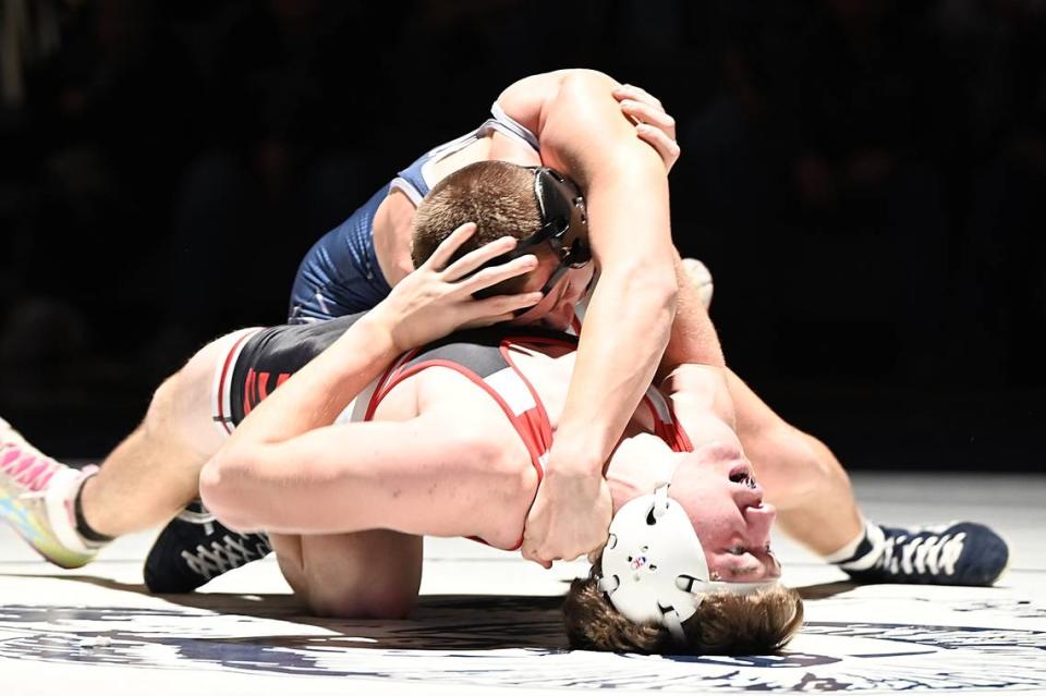 Penns Valley’s Ty Watson records nearfall points on Clearfield’s Ty Aveni in their 152-pound bout of the Rams’ 37-24 loss on Dec. 7. Watson picked up a 7-0 win over Aveni. Jennie Tate/For the CDT