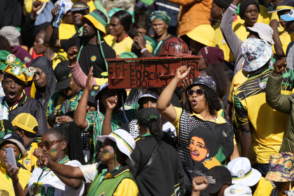 African National Congress supporters wait for South African President Cyril Ramaphosa to arrive at the Siyanqoba rally at FNB stadium in Johannesburg, South Africa, Saturday, May 25, 2024. South African will vote in the 2024 general elections on May 29. (AP Photo/Jerome Delay)