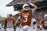 Texas quarterback Quinn Ewers (3) celebrates after scoring a touchdown against Baylor during the first half of an NCAA college football game in Austin, Texas, Friday, Nov. 25, 2022. (AP Photo/Eric Gay)