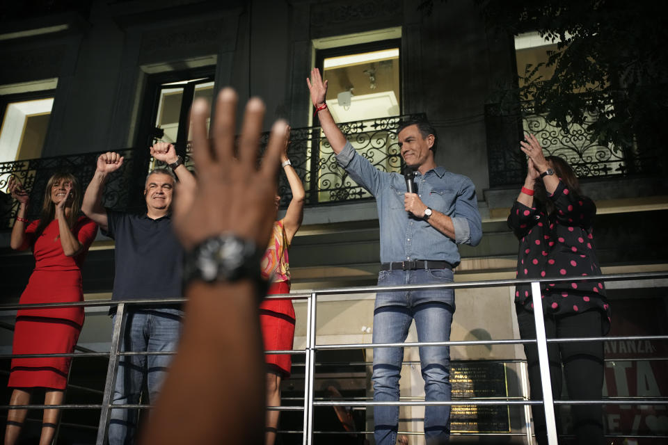 Socialist Workers' Party leader and current Prime Minister Pedro Sanchez greets supporters outside the party's headquarters in Madrid, Spain, Sunday July 23, 2023. Spain's conservative Popular Party is set to narrowly win the country's national election but without the majority needed to topple the coalition government of Socialist Prime Minister Pedro Sánchez. (AP Photo/Emilio Morenatti)