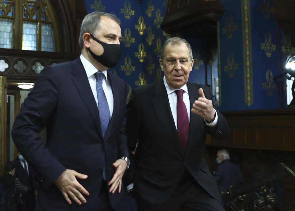 In this photo released by Russian Foreign Ministry Press Service, Russian Foreign Minister Sergey Lavrov, right, meets with Azerbaijani Foreign Minister Jeyhun Bayramov in Moscow, Russia, Tuesday, Oct. 20, 2020. (Russian Foreign Ministry Press Service via AP)