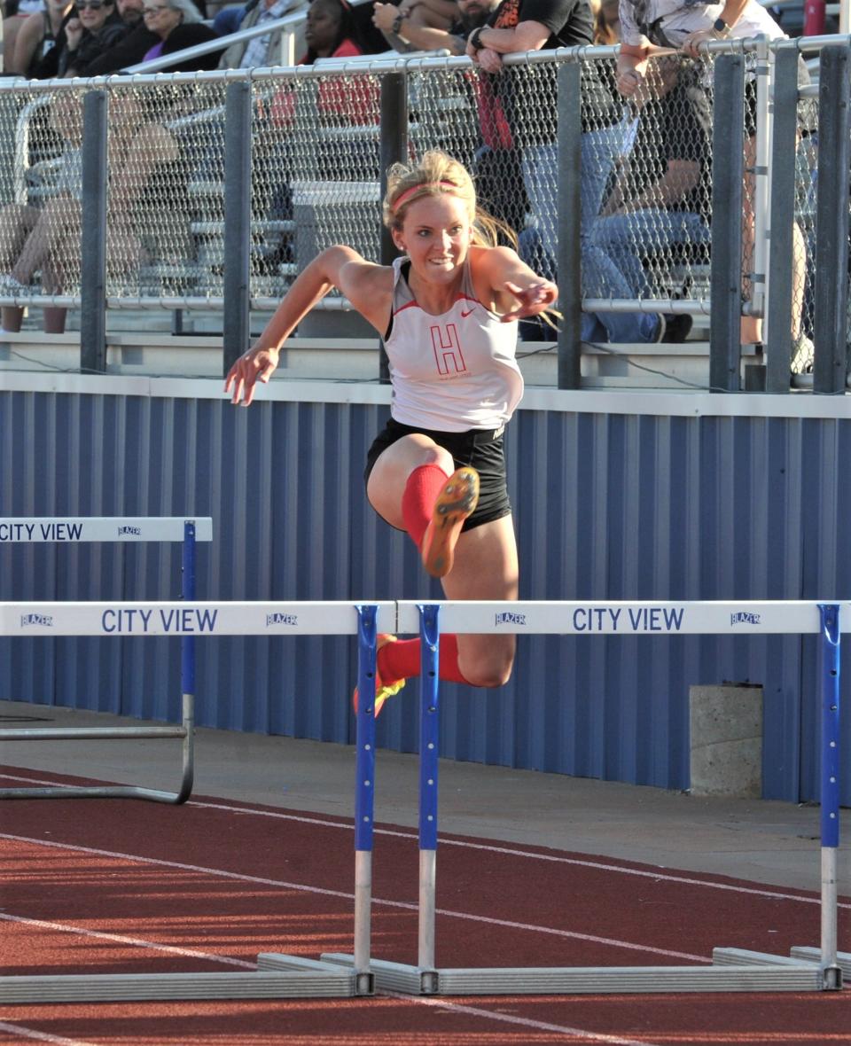 Holliday's Payton Murray wins the 100 meter hurdles during the District 7-3A Track Meet in City View on Thursday, April 14, 2022.