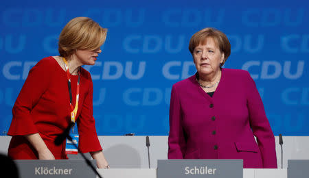 German Chancellor Angela Merkel and Julia Kloeckner during a Christian Democratic Union (CDU) party congress in Berlin, Germany, February 26, 2018. REUTERS/Hannibal Hanschke