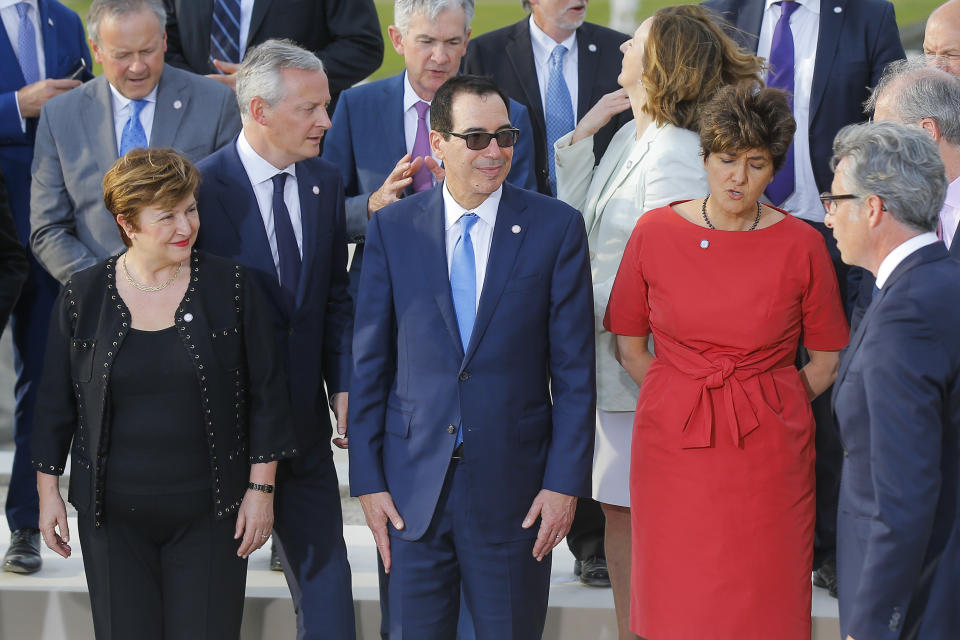 US Treasury Secretary Steve Mnuchin, front center, stands next to Chief Executive of the World Bank Kristalina Georgieva, front left, and Bank of France Deputy Governor Sylvie Goulard, front right, prior a group photo at the G-7 Finance in Chantilly, north of Paris, on Wednesday, July 17, 2019. The Group of Seven rich democracies' top finance officials gathered Wednesday at a chateau near Paris in search of common ground on the threats posed by digital currencies. (AP Photo/Michel Euler)