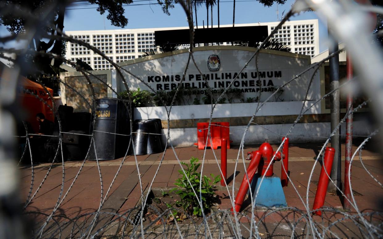 Barbed wire is protecting the General Election Commission in Jakarta - REUTERS