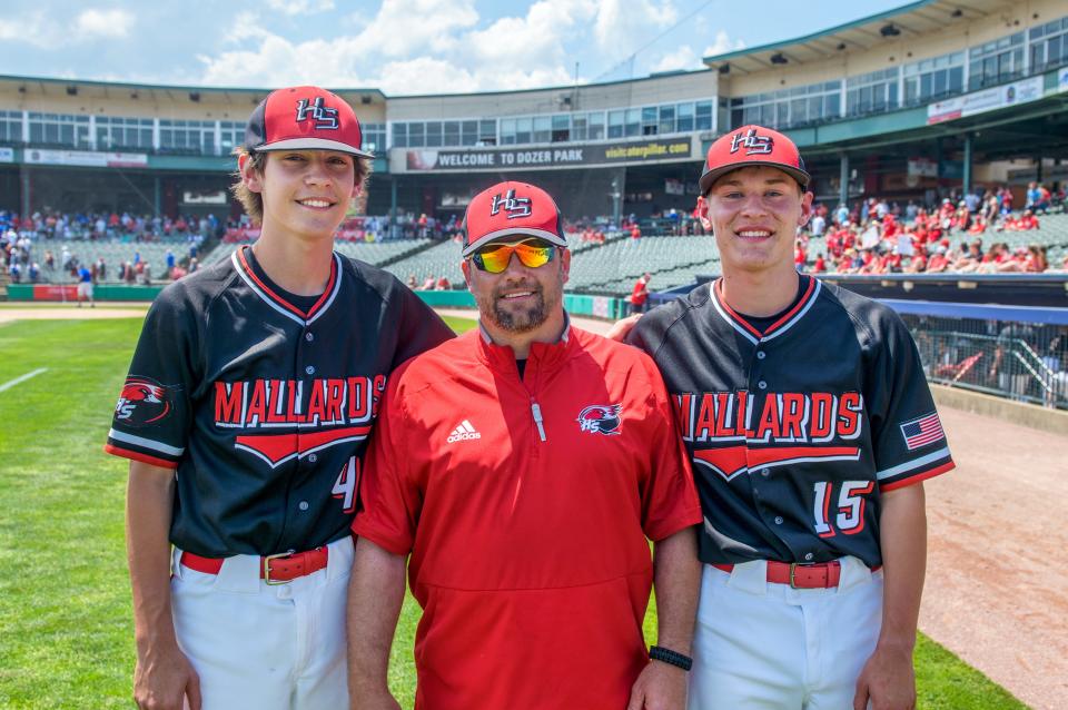 Henry-Senachwine assistant coach Teddy Rowe, middle, stands with his two nephews, freshman Carson Rowe, left, and junior Preston Rowe on the field at Dozer Park before the start of their Class 1A baseball state semifinal Friday, June 2, 2023 in Peoria.