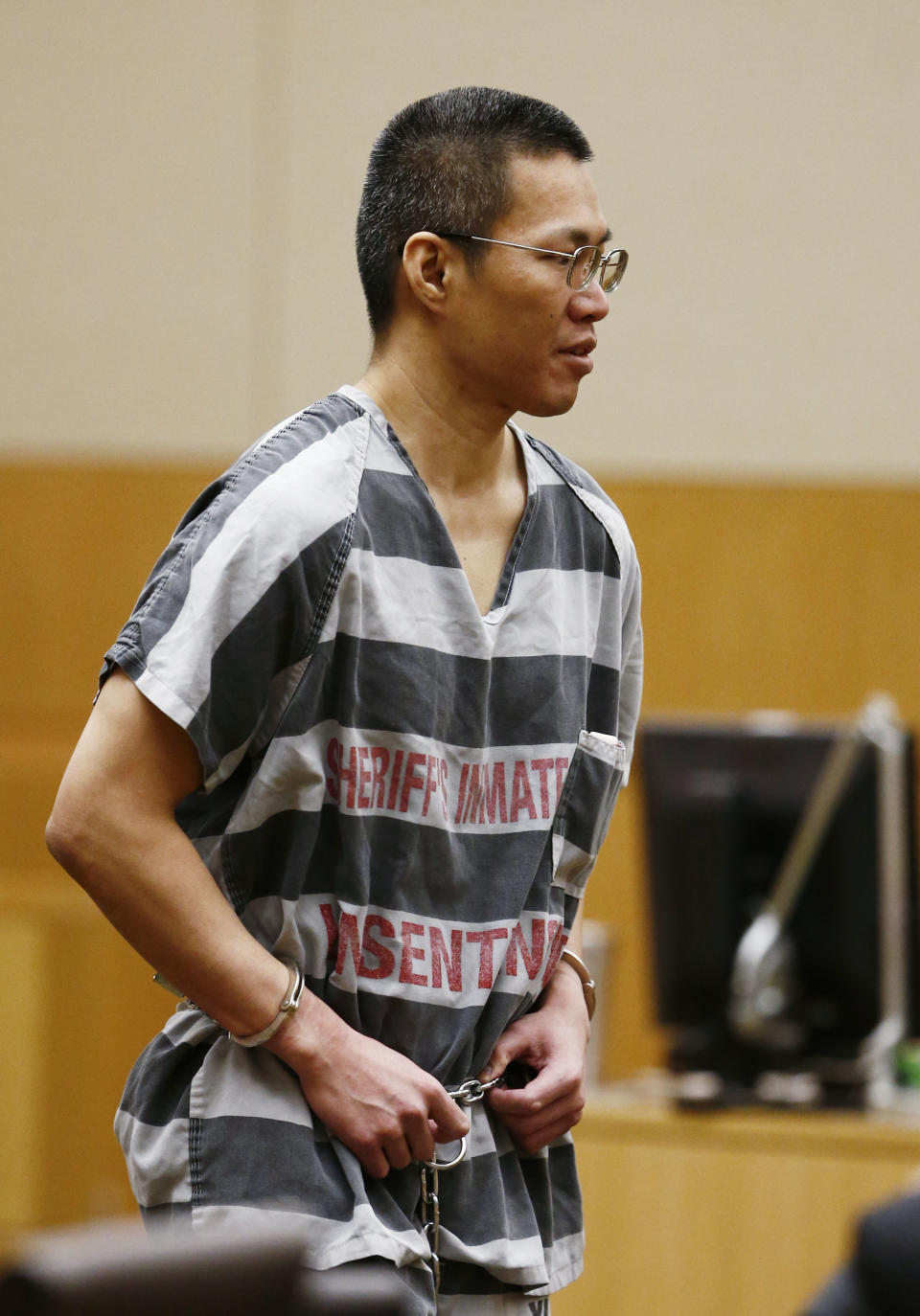 Johnathan A. Doody leaves Maricopa County Superior Court Joseph Kreamer on Friday, March 14, 2014 in Phoenix, Ariz. Doody, convicted of killing nine people, including six monks, during a robbery at a Buddhist temple in metro Phoenix was sentenced Friday to 249 years in prison. Doody was founded guilty in January of first-degree murder in the deaths of six monks, one nun and two helpers who were shot in the back of the head and were found arranged face-down in a circle in August 1991 at the Wat Promkunaram temple west of Phoenix. (AP Photo/The Arizona Republic, Rob Schumacher, Pool)