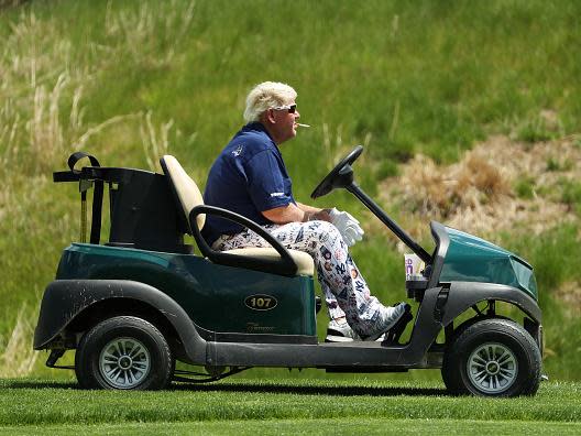John Daly smokes a Marlboro Red on his route around Bethpage Black (Getty)