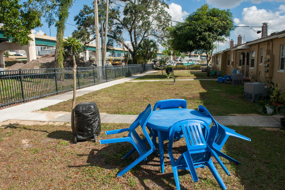 Backyards in the Griffin Park housing project look directly out at&nbsp;a highway. (Photo: Chris McGonigal/HuffPost)