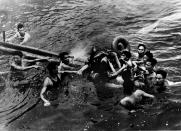 <p>Lt. Cmdr. John McCain is rescued from Hanoi’s Truc Bach lake by Hanoi residents after his Navy warplane was shot down on Oct. 26, 1967. (Photo: AFP/Getty Images) </p>