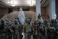 <p>Members of the National Guard prepare in the Capitol Visitors Center on Capitol Hill in Washington, DC, January 13, 2021.</p>