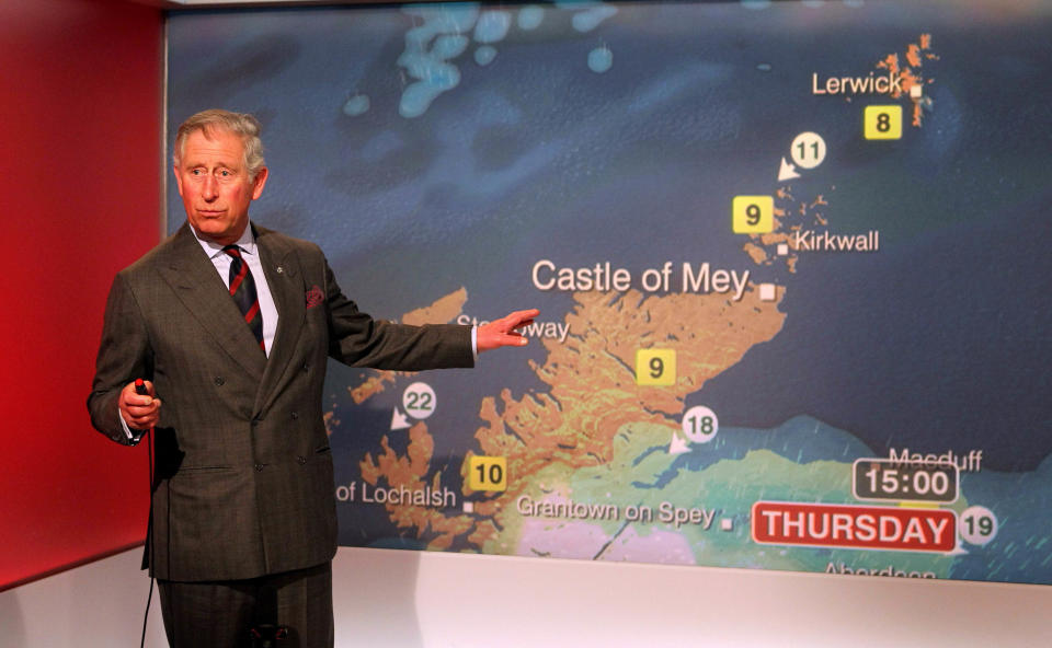 BRitain's Prince Charles reads the weather in the Six O'Clock studio whilst on a tour of the BBC Scotland Headquarters in Glasgow, Scotland where they met staff to celebrate sixty years of BBC Scotland Television Thursday May 10, 2012. (AP Photo/Andrew Milligan/PA Wire) UNITED KINGDOM OUT