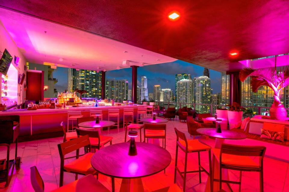 Neon lights illuminate Rosa Sky rooftop bar in downtown Miami.