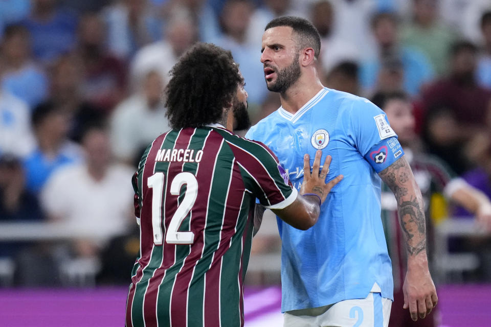 Fluminense's Marcelo, left, speaks to Manchester City's Kyle Walker during a scuffle at the end of the Soccer Club World Cup final match between Manchester City FC and Fluminense FC at King Abdullah Sports City Stadium in Jeddah, Saudi Arabia, Friday, Dec. 22, 2023. Manchester City won 4-0. (AP Photo/Manu Fernandez)