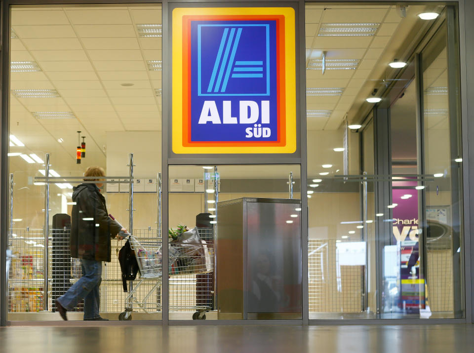 RUESSELSHEIM, GERMANY - APRIL 8: A shopper pushes a shopping cart in an Aldi store on April 8, 2013 in Ruesselsheim near Frankfurt, Germany. Aldi, which today is among the world’s most successful discount grocery store chains, will soon mark its 100th anniversary and traces its history back to Karl Albrecht, who began selling baked goods in Essen on April 10, 1913 and founded the Aldi name by shortening the phrase Albrecht Discount. His sons Karl Jr. and Theo expanded the chain dramatically, creating 300 stores by 1960 divided between northern and southern Germany, with Aldi Nord and Aldi Sued, respectively. Today the two chains have approximately 4,300 stores nationwide and have also expanded into other countries across Europe and the USA. Aldi Nord operates in the USA under the name Trader Joe’s. (Photo by Ralph Orlowski/Getty Images)