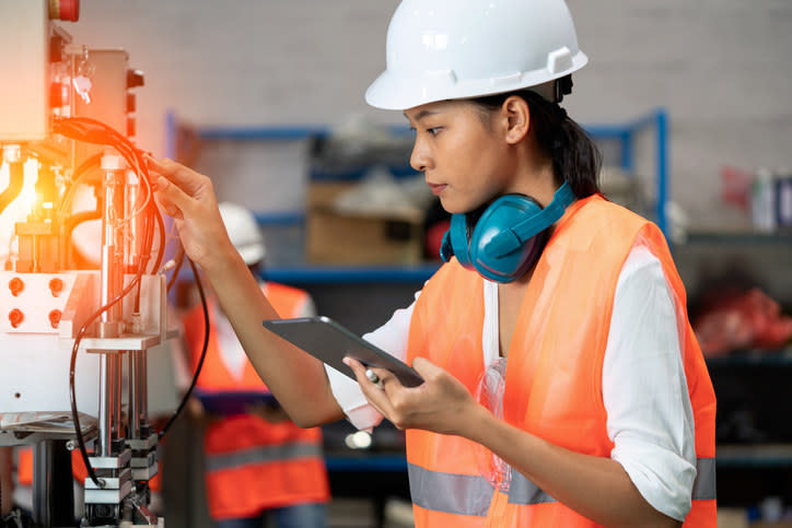 A woman working on a machine