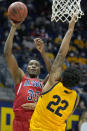 Arizona center Christian Koloko (35) shoots over California forward Andre Kelly (22) during the first half of an NCAA college basketball game in Berkeley, Calif., Sunday, Jan. 23, 2022. (AP Photo/Tony Avelar)