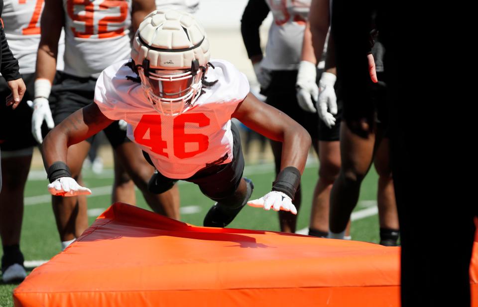 Oklahoma State's Temerrick Johnson goes through a drill during an Oklahoma State University Cowboys spring football practice in Stillwater, Okla., Tuesday, March 26, 2024.