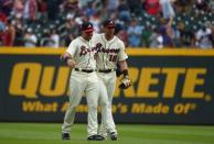 Sep 23, 2018; Atlanta, GA, USA; Atlanta Braves outfielder Adam Duvall (23) and out fielder Lane Adams (18) celebrate after defeating the Philadelphia Phillies at SunTrust Park. Mandatory Credit: Adam Hagy-USA TODAY Sports