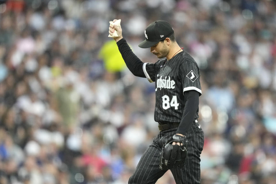 Chicago White Sox starting pitcher Dylan Cease goes to the rosin bag after walking New York Yankees' Aaron Judge during the third inning of a baseball game Monday, Aug. 7, 2023, in Chicago. (AP Photo/Charles Rex Arbogast)