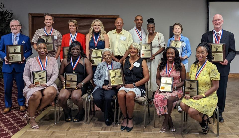 The Indiana Association of Track and Cross Country Coaches' Hall of Fame Class of 2022 includes Bloomington South coach Larry Williams (back row, far right).