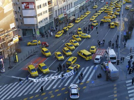 Taxis block a main road in Budapest's city centre, Hungary, January 18, 2016. REUTERS/Laszlo Balogh