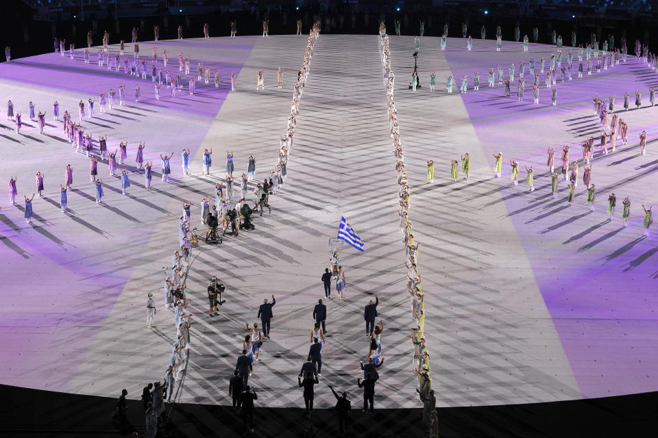 <p>TOKYO, JAPAN - JULY 23: Flag bearers Anna Korakaki and Eleftherios Petrounias of Team Greece lead their teammates out during the Opening Ceremony of the Tokyo 2020 Olympic Games at Olympic Stadium on July 23, 2021 in Tokyo, Japan. (Photo by Ezra Shaw/Getty Images)</p> 