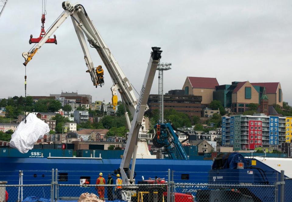 Debris from the Titan submersible, recovered from the ocean floor near the wreck of the Titanic, is unloaded from the ship Horizon Arctic at the Canadian Coast Guard pier in St. John's, Newfoundland, June 28, 2023. (AP)