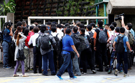 Journalists wait to enter the Shah Alam High Court, where Indonesian Siti Aisyah and Vietnamese Doan Thi Huong are on trial for the killing of Kim Jong Nam, the estranged half-brother of North Korea's leader, on the outskirts of Kuala Lumpur, Malaysia October 2, 2017. REUTERS/Lai Seng Sin