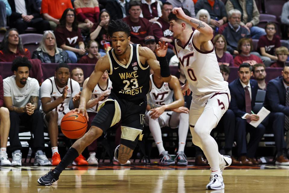 Mar 2, 2024; Blacksburg, Virginia, USA; Wake Forest Demon Deacons guard Hunter Sallis (23) drives to the basket Virginia Tech Hokies guard Hunter Cattoor (0) during the first half at Cassell Coliseum. Peter Casey-USA TODAY Sports
