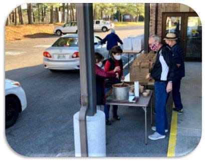 People who drive by First Presbyterian Church in Oak Ridge on Thursday can get meals and a free bag of groceries through the church's 'Welcome Table' program.