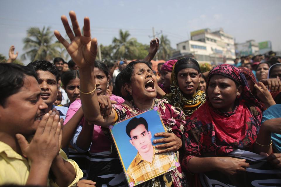 Relatives of victims killed in the collapse of Rana Plaza mourn on the first year anniversary of the accident, as they gather in Savar