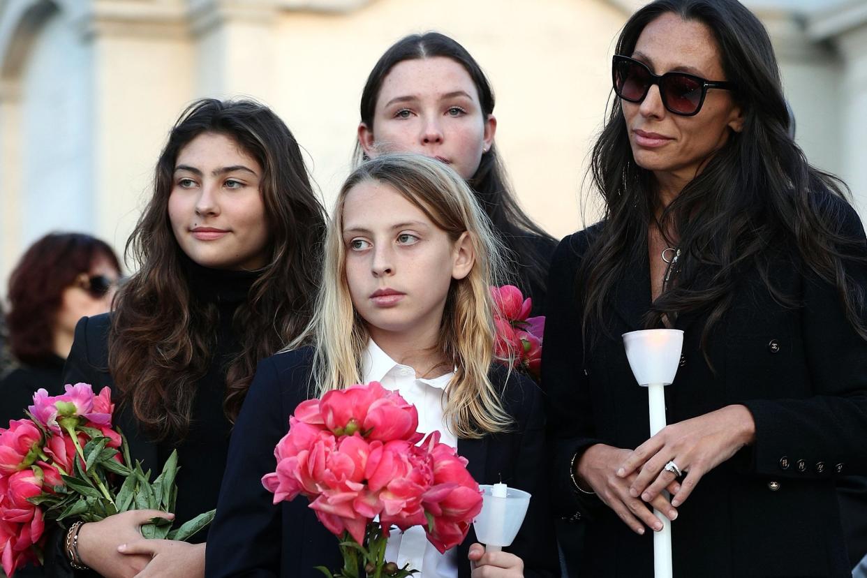 Vicky Cornell (R) and family Toni, Christopher and Lilli Jean Cornell attended a vigil on the anniversary of his death last month: Getty Images