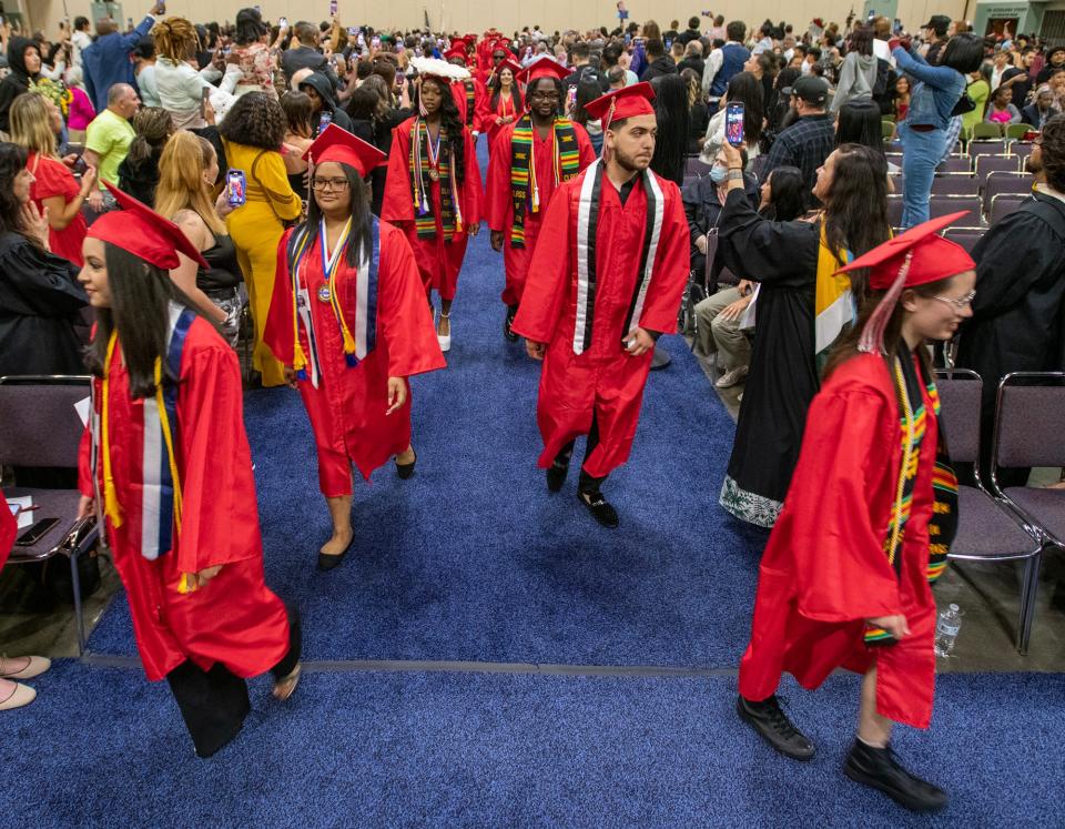 South High Community School graduates file into the DCU Center for graduation exercises Friday.