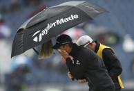 Justin Rose of England wipes his face as he walks to the fourth tee during the final round of the British Open golf championship on the Old Course in St. Andrews, Scotland, July 20, 2015. REUTERS/Lee Smith