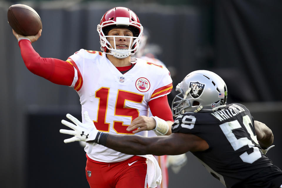 FILE - In this Dec. 2, 2018, file photo, Kansas City Chiefs quarterback Patrick Mahomes (15) passes against Oakland Raiders linebacker Tahir Whitehead (59) during the second half of an NFL football game in Oakland, Calif. “I think the message for the whole team is we’re not satisfied with where we’re at,” says Chiefs quarterback Patrick Mahomes. Kansas City can clinch top seed in the AFC and the AFC West under certain circumstances. (AP Photo/Ben Margot, File)