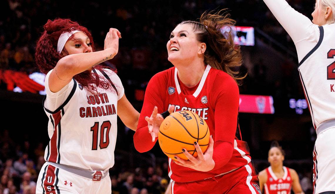 N.C. State’s River Baldwin drives to the basket past South Carolina’s Kamilla Cardoso during the first half of the Wolfpack’s Final Four matchup at Rocket Mortgage FieldHouse on Friday, April 5, 2024, in Cleveland, Ohio. Kaitlin McKeown/kmckeown@newsobserver.com