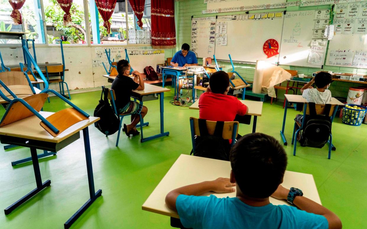 Children wearing face masks at school in Tahiti - Suliane Favennec/AFP