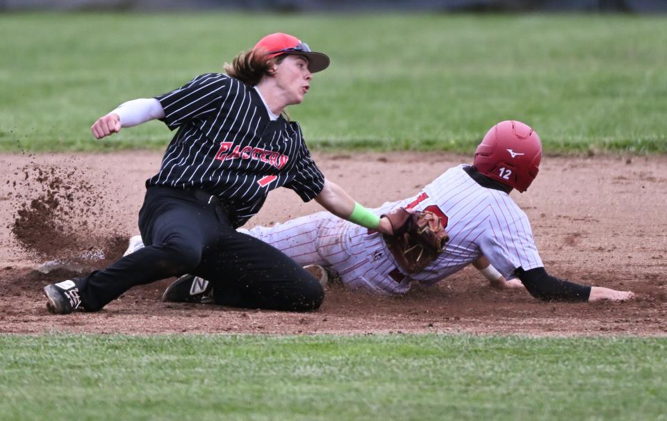 Eastern Greene’s Kasen Cullison (7) tags out Bloomfield’s Tyler Patterson trying to steal second base during the baseball game at Eastern Greene on Friday, May 3, 2024.