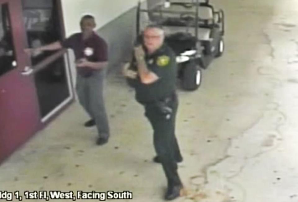 Video still of Scot Peterson during the Parkland shooting. Source: AP