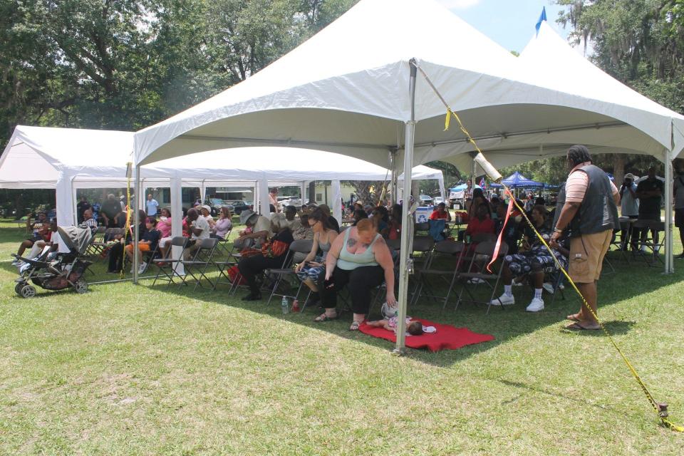 People gather under tents at the Cotton Club Museum and Cultural Center in southeast Gainesville to help celebrate Florida's Emancipation Day on Saturday.
(Photo: Photo by Voleer Thomas/For The Guardian)