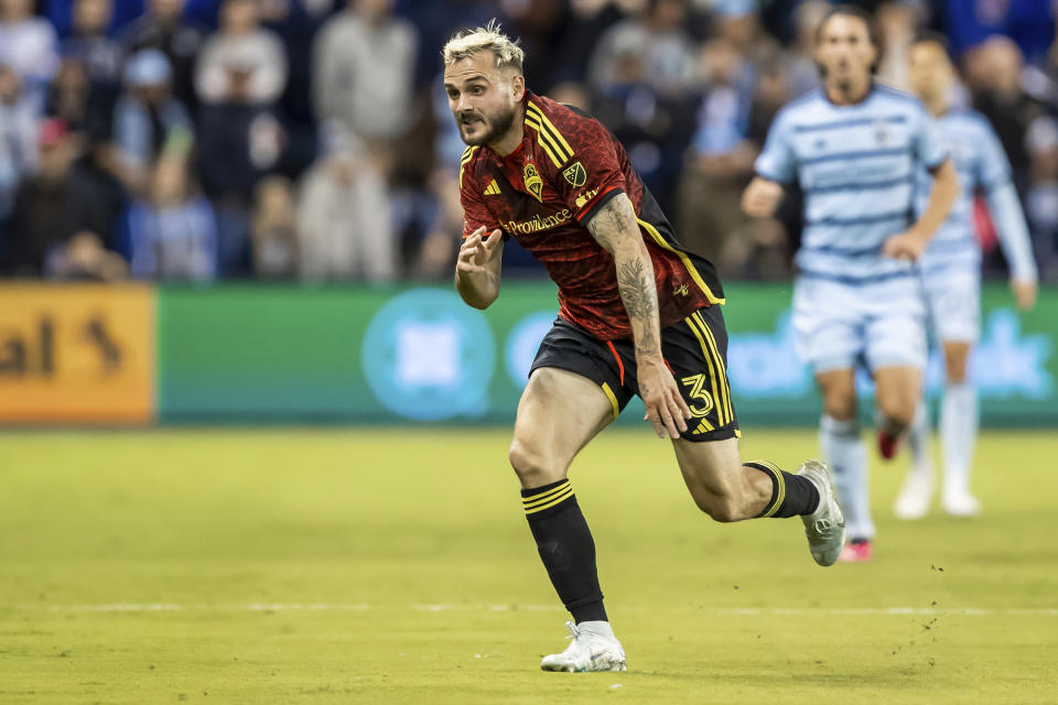 Seattle Sounders forward Jordan Morris (13) breaks for an attacking run during the second half of an MLS soccer match against Sporting Kansas City, Saturday, March 25, 2023, in Kansas City, Kan. (AP Photo/Nick Tre. Smith)