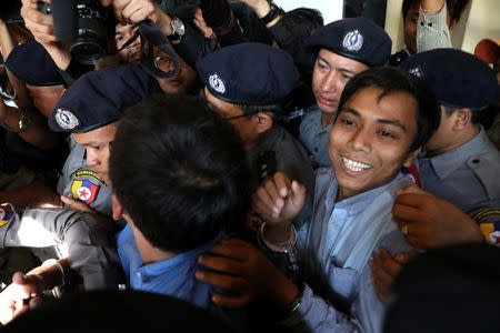 Reuters journalists Kyaw Soe Oo (R) and Wa Lone (L) appear in court in Yangon, Myanmar January 10, 2018. REUTERS/Stringer