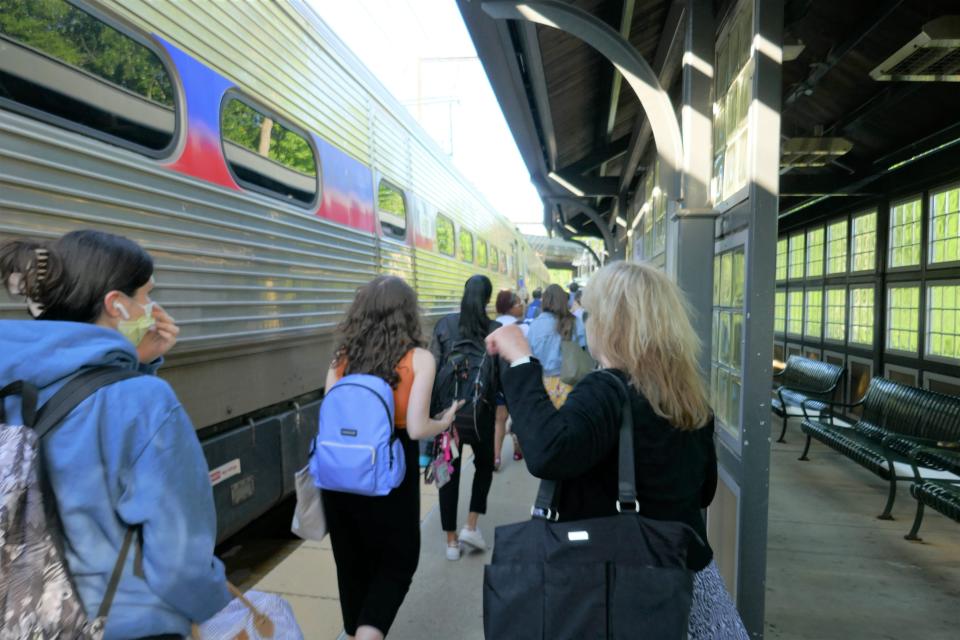 Riders prepare to board a SEPTA train at the Woodbourne station in Middletown Tuesday morning.  SEPTA ambassadors who were helping people at the station said there were more riders Tuesday than Monday.