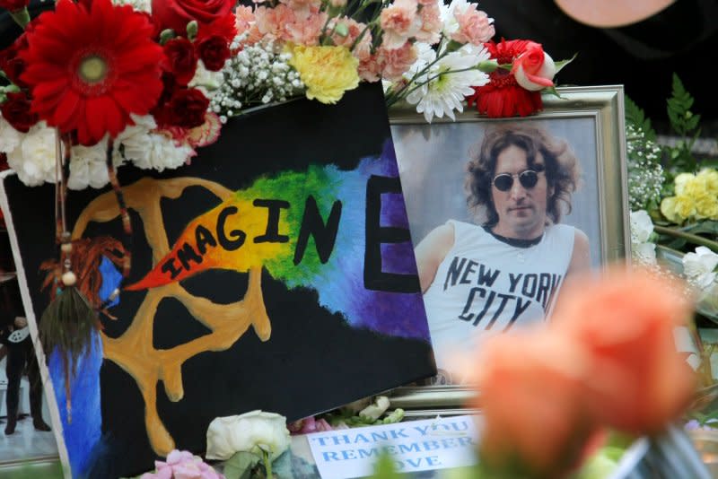 A picture of John Lennon is among the many items placed on the "Imagine" mosaic as fans gather at Strawberry Fields in Central Park to pay tribute to the musician on December 8, 2010 in New York City. On August 24, 1981, Mark Chapman, who claimed devils forced him to kill Lennon and God told him to confess, was sentenced to 20 years to life in prison for the fatal shooting. File Photo by Monika Graff/UPI