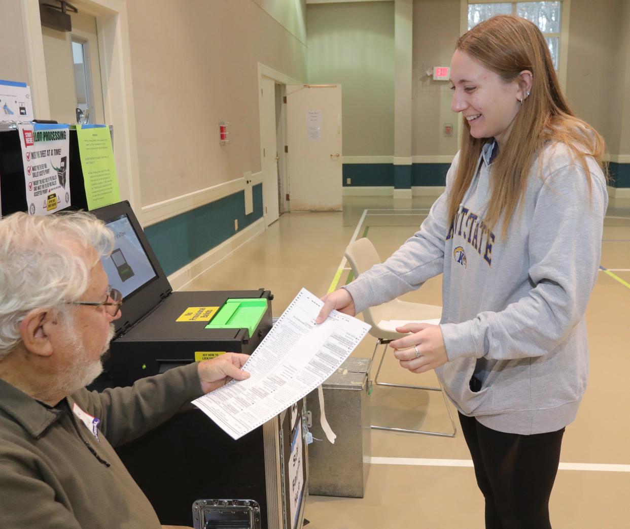 Samantha Hermann gets help casting her ballot from poll election officer Jack Liberman on Tuesday, Nov. 7, 2023, in Bath Township, Ohio, at Bath United Church of Christ. [Phil Masturzo/ Beacon Journal]