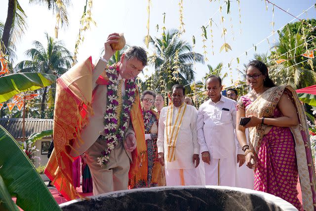 <p>Jonathan Brady/PA Images via Getty Images</p> Vice Admiral Sir Timothy Laurence smashes a coconut at Vajira Pillayar Kovil Hindu temple in Colombo, Sri Lanka on Jan. 12.